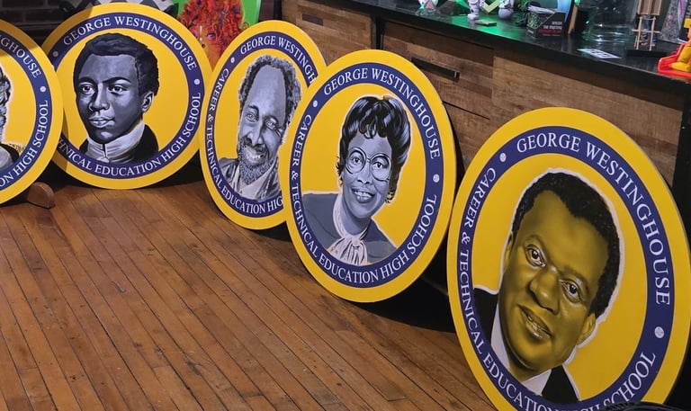 Images of scientists and inventors painted on board for a school mural installation.