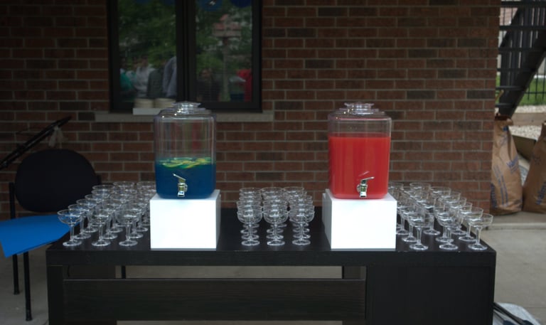 a table with drinks and glasses on it