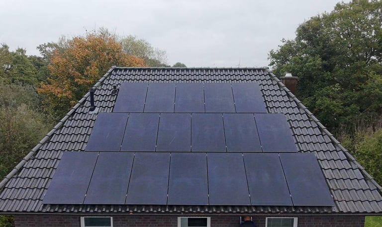a house with solar panels installed on the roof Oldenburg
