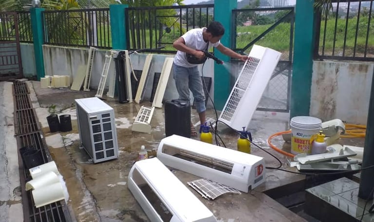 Suasana team member performing specialized automation and electrical repair service.