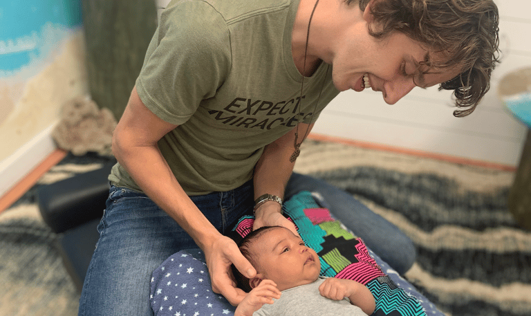 Peaceful, sleeping baby in Franklin, TN after infant colic relief through expert chiropractic care.