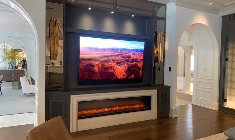 living room with a television and a fireplace