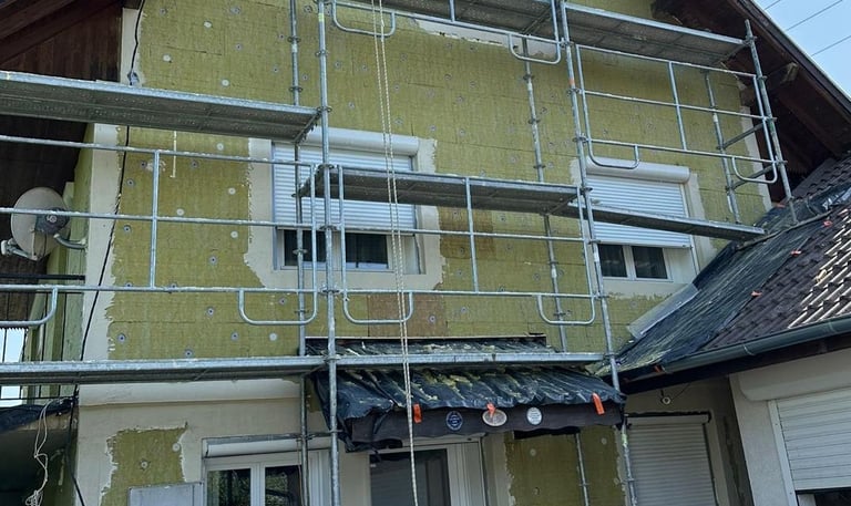 a house with a scafaffe on a scaffolded up to