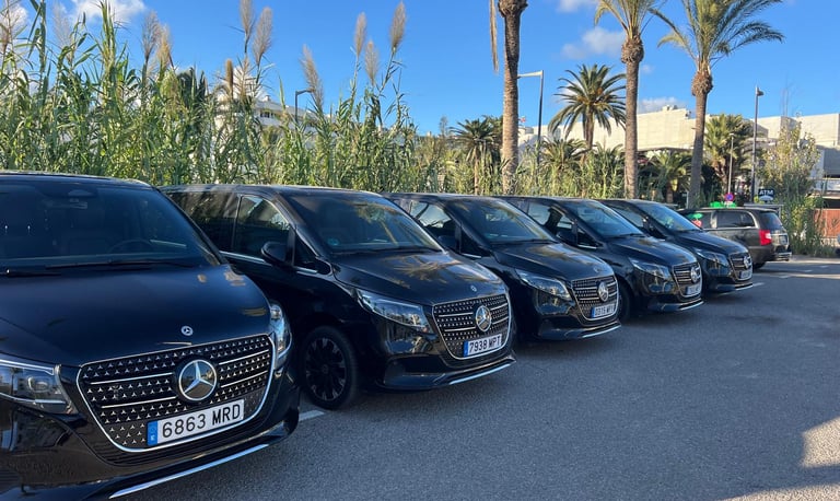 a row of cars parked in a parking lot