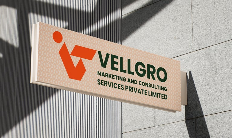 Vellgro Marketing and Consulting Services logo on a modern outdoor office building sign.