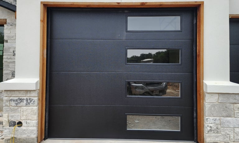 Black flush style with tinted windows on the right hand side installed by A's garage doors.