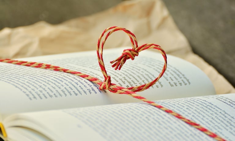 a book with a heart shaped knot tied to a book, a book for awareness, meditation and mindfulness