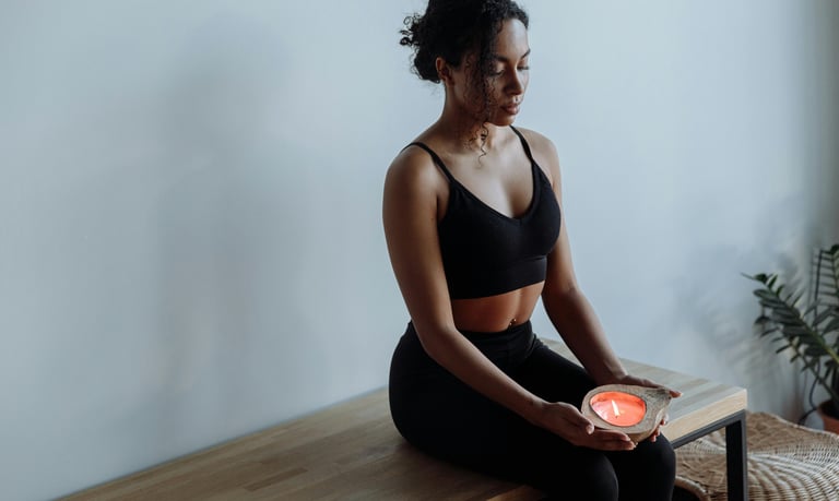 a woman sitting on the floor meditating