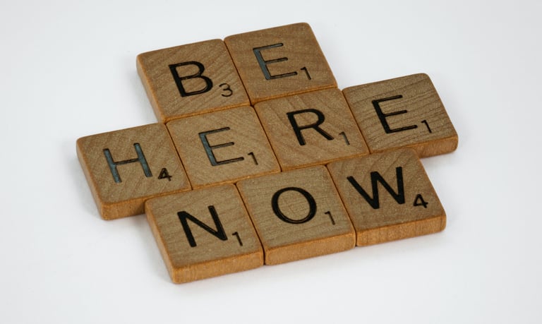 Letter pieces "Be Here Now"