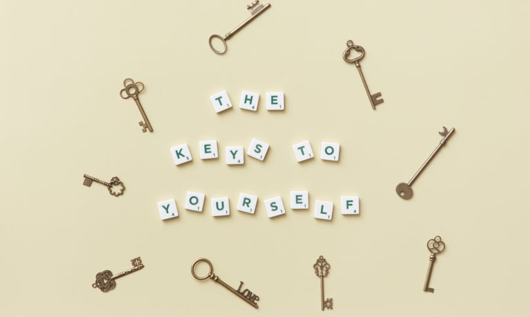Keys and letter pieces spelling out the "The keys to yourself."