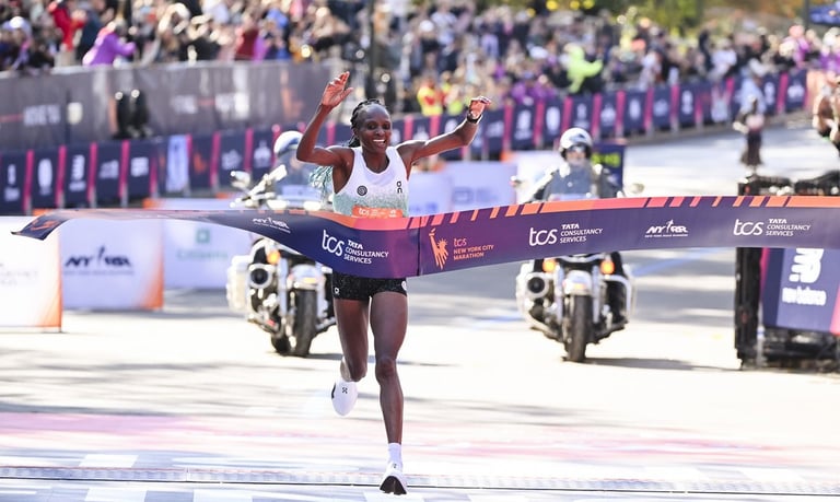 Hellen Obiri of Kenya celebrating her victory and new course record (2:19:51) immediately after crossing the finish line of t
