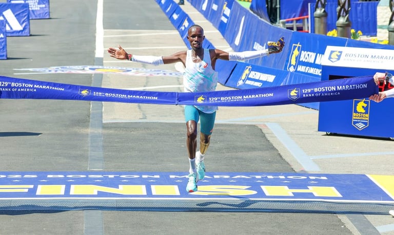 John Korir celebrating his course record victory at the 2025 Boston Marathon.
