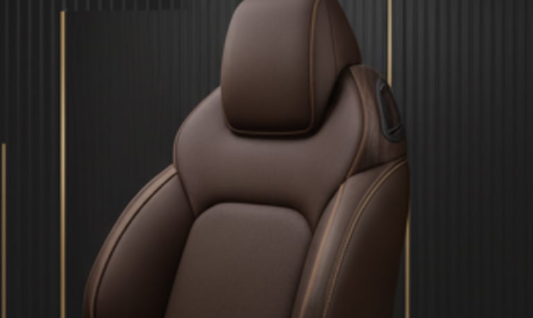 High-quality brown leather car seat on a dark textured background.