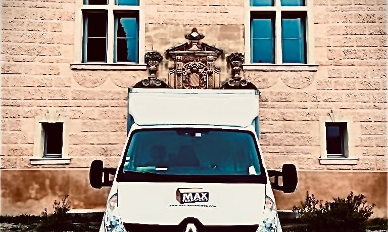 a van parked in front of a building