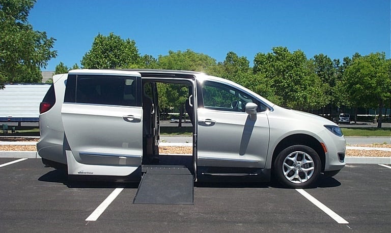 Side View of a Chrysler Pacifica VMI Northstar In-Floor Ramp  being Deployed