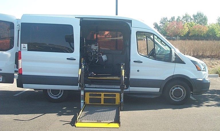 Side View of a Ford Transit Mid Roof with the BraunAbility Millennium Lift