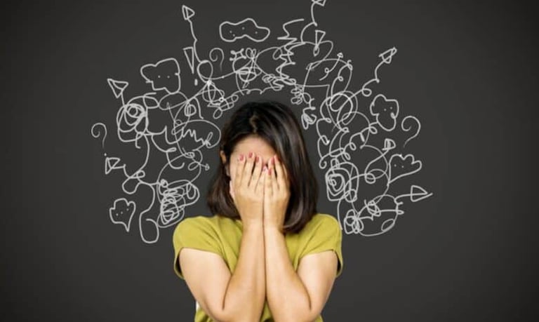 a woman covering her face with her hands