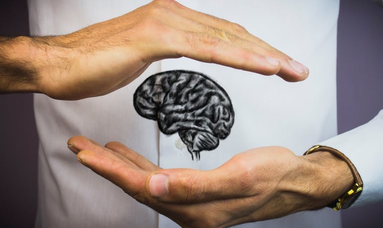 a man holding a brain map of a brain
