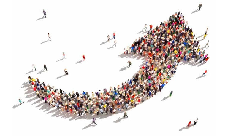 a group of people standing in a circle with a large arrow pointing up