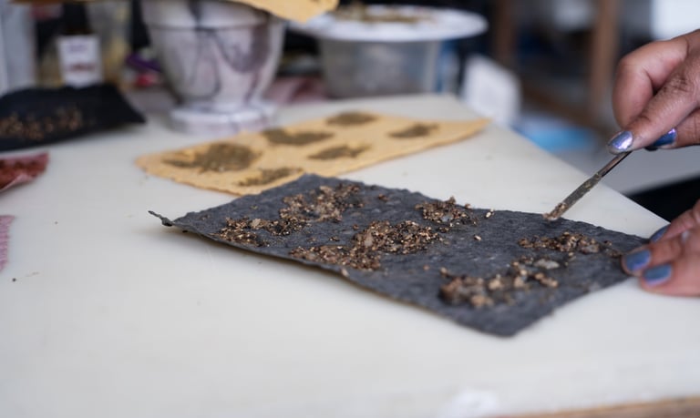 Black pepper paste on black handmade paper 