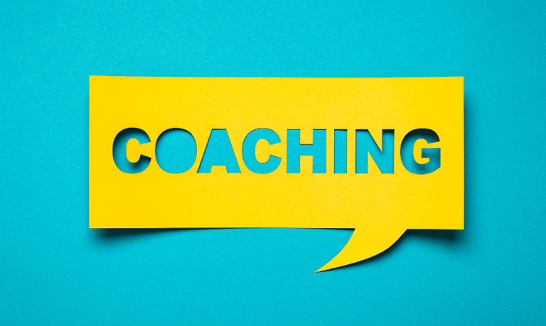 a yellow speech bubble with the word coaching on it
