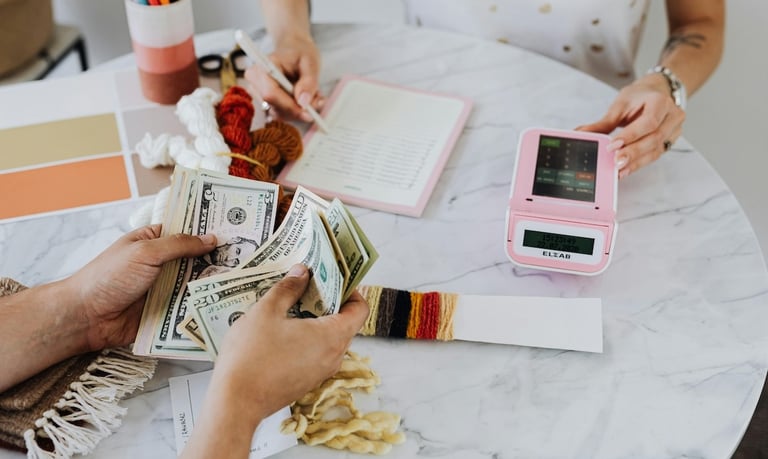 investing and longevity - a woman is holding money and a cell phone
