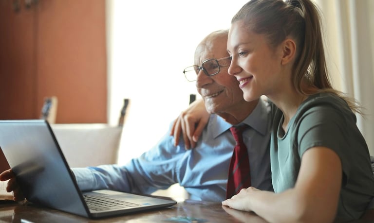 Long lasting relationships and longevity - a man and woman sitting at a table with a laptop