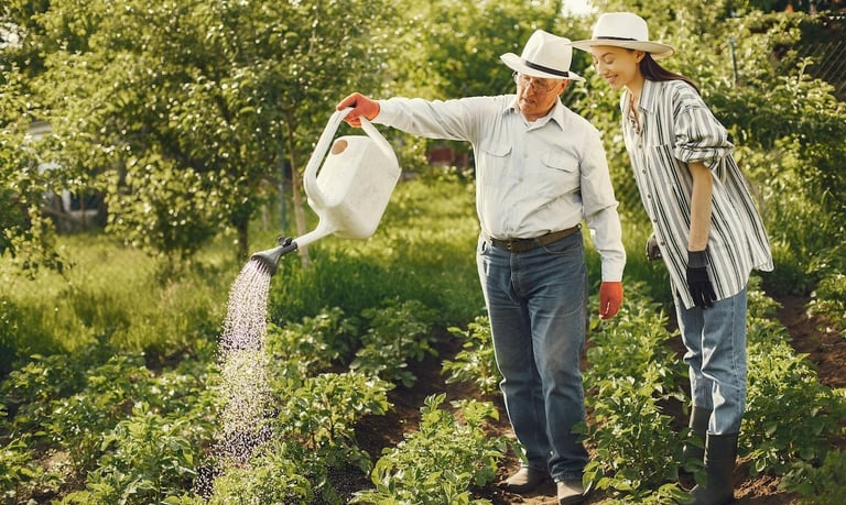 a man and woman watering in a garden as for personal growth