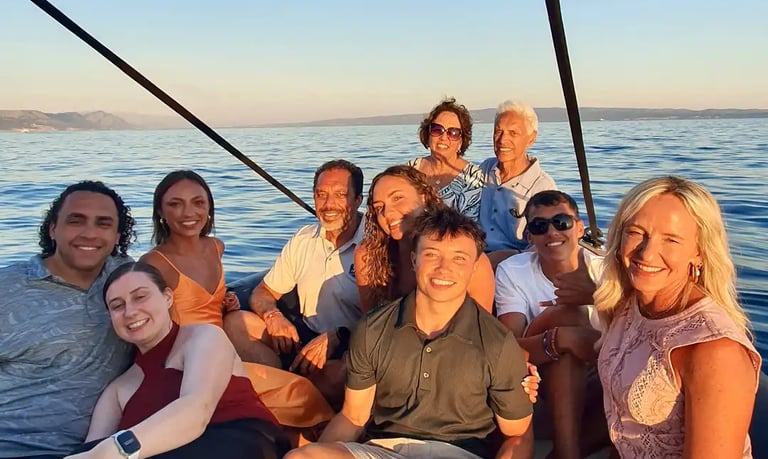 Large family posing together on a speedboat during a sunset boat tour in Split