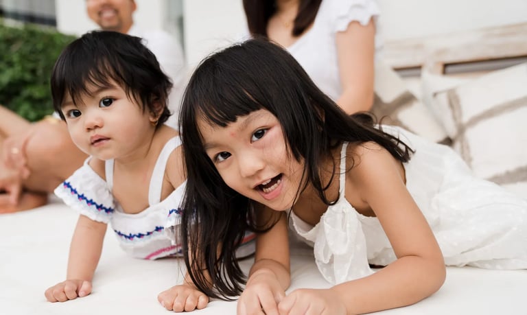 Natural portrait of children relaxing indoors during a family photography session at a private villa in Seminyak Bali.