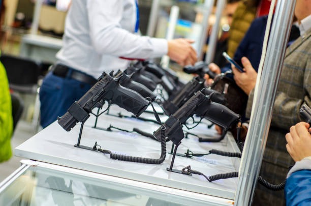 gun show display and helping customers