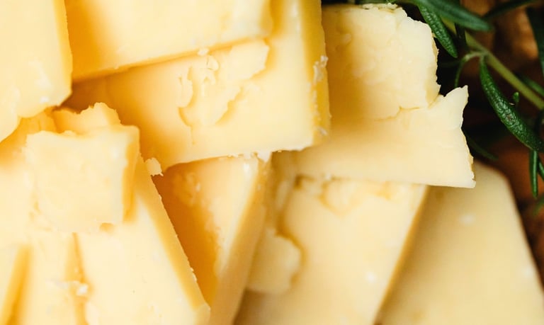 Cheddar slices on a board