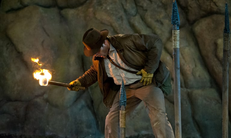 a man in a suit and tie is holding a torch