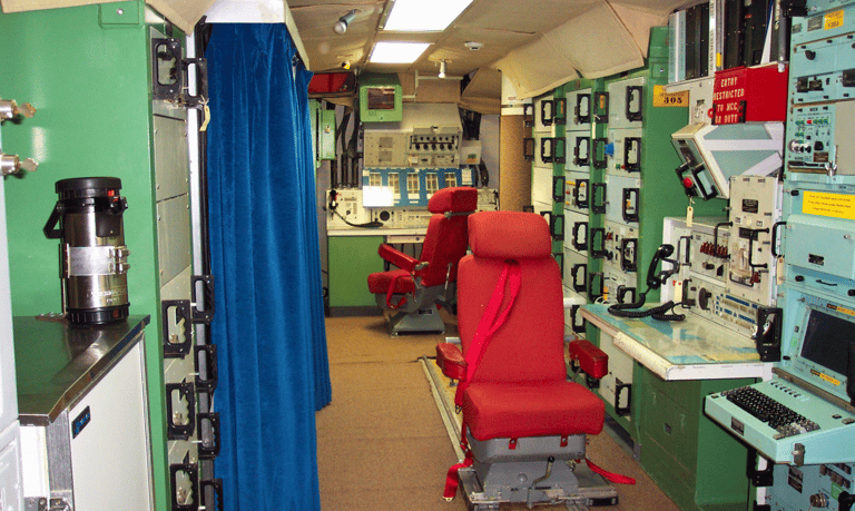 missile control room with a chair and a computer