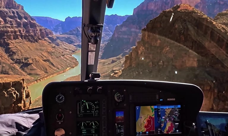 POV from inside a helicopter cockpit flying over the Colorado River in the Grand Canyon for Soarin' Across America.