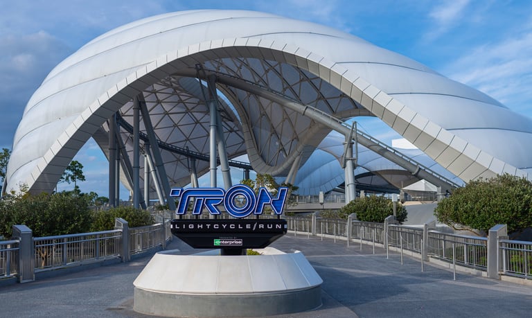 a large white building with a large metal structure