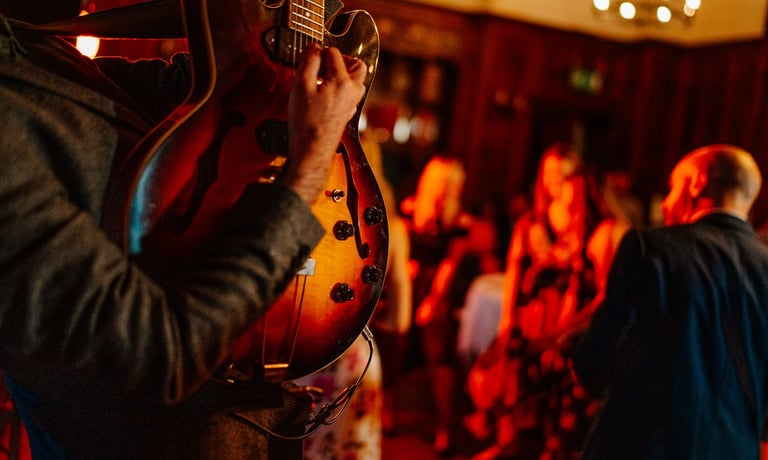 Man playing guitar ar wedding