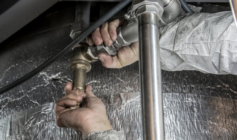 Plumbing business owner meeting with broker