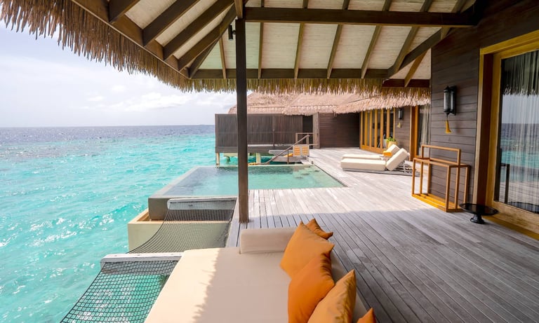Ayada Maldives sunset ocean suite with pool outdoor