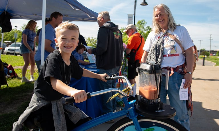 Young boy on our blender bike powering a smoothie!