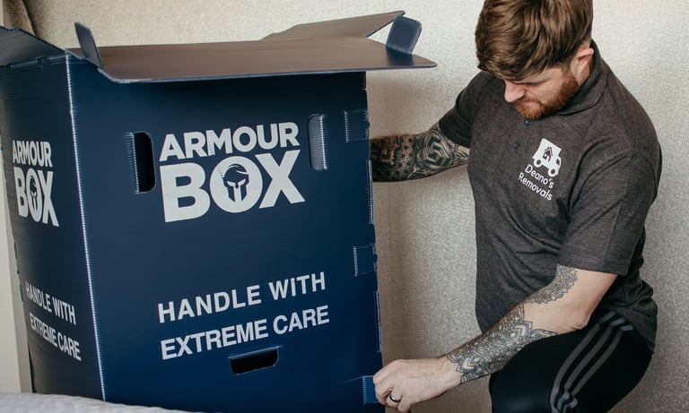 deano removals worker next to a storage box
