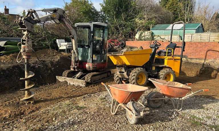 Breaker tool removing old slab during groundwork in Oldbury