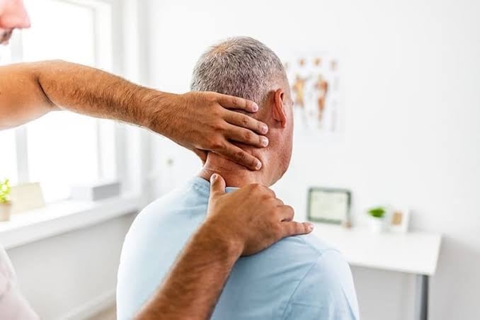 Home physiotherapy session treating a patient with cervical stiffness and posture imbalance