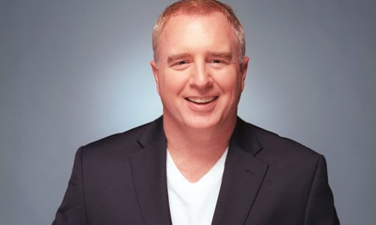 A headshot of Tim Ray. 