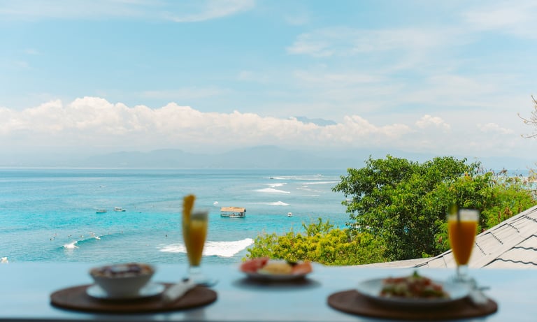 two glasses of champagne and a glass of champagne on a table