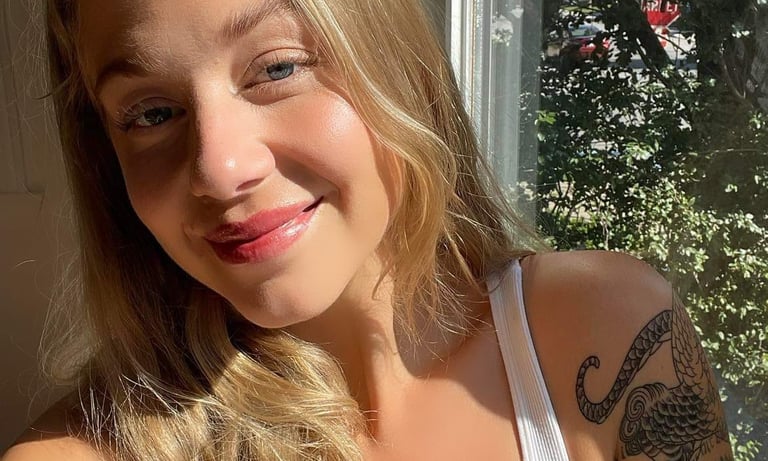 blonde with tattoos and lipblush