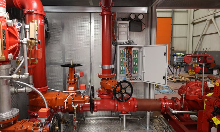 a fire hydrant with a red fire hydrant in the background