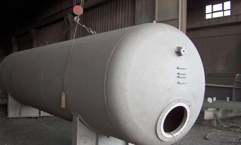 a large metal tank sitting in a warehouse