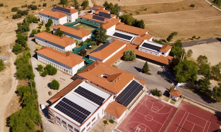 a school with solar panels on the roof