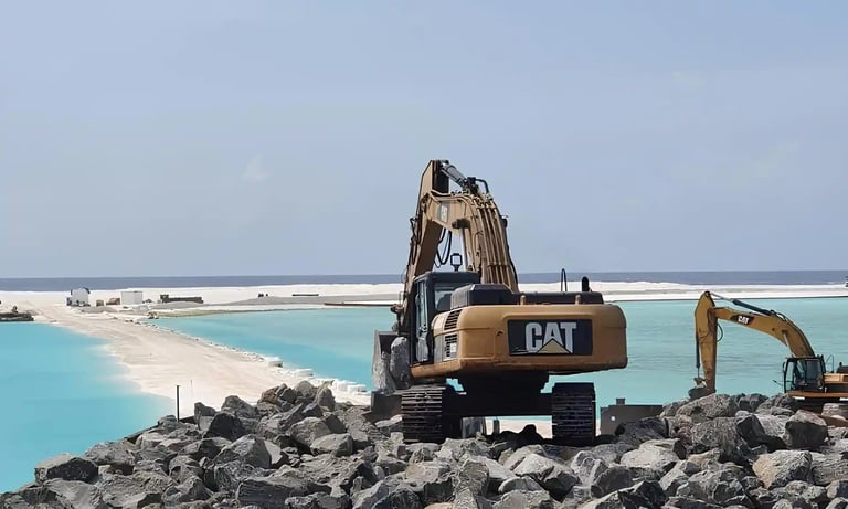 a construction worker is working on a beach